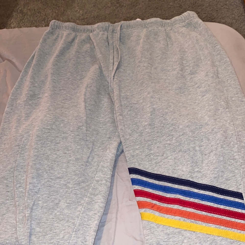Grey sweat pants with color strips on left leg